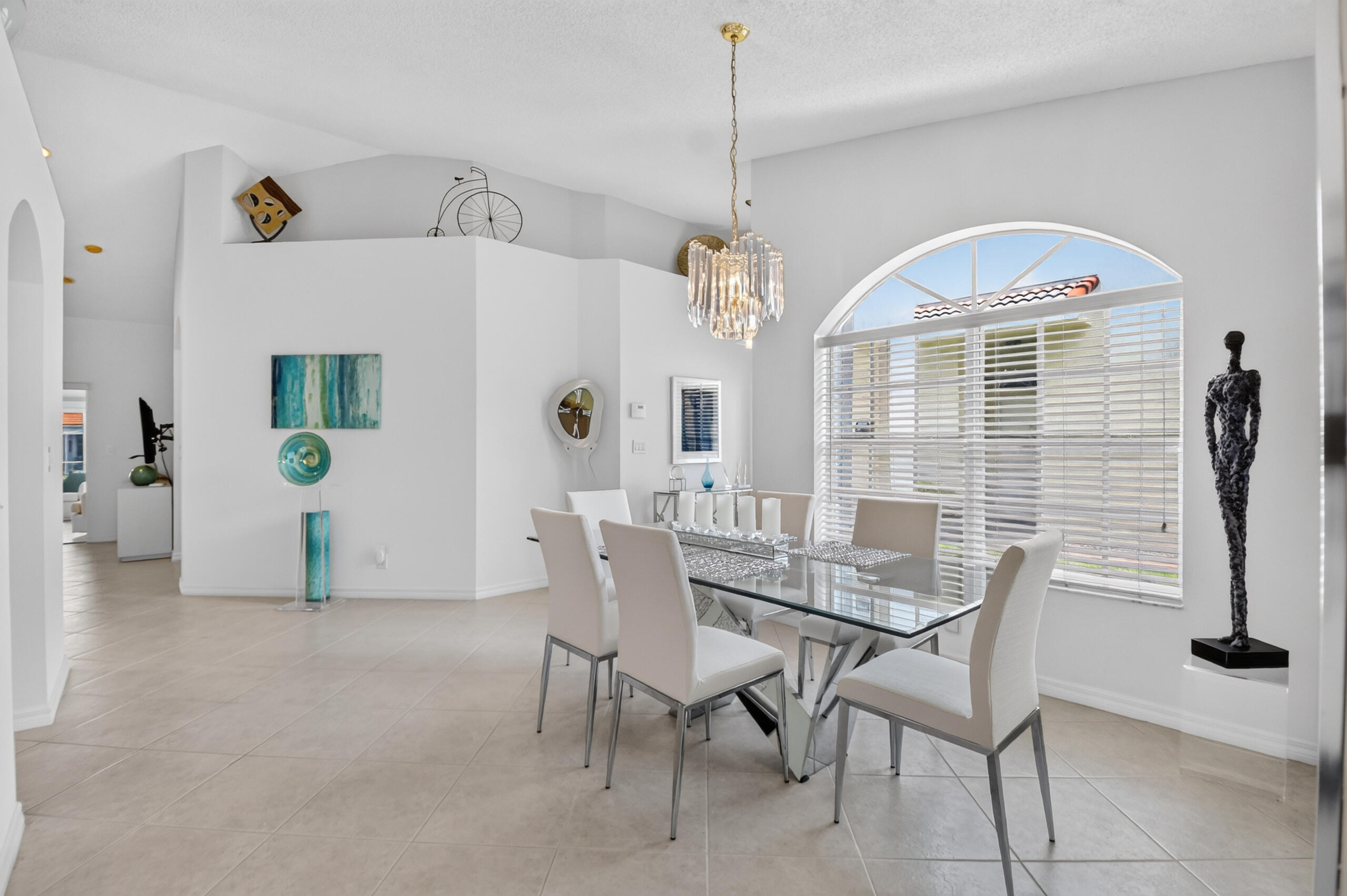 15340 Floral Club Road Delray Beach, FL 33484 - Photo 6 of 42 a view of a dining room with furniture and chandelier