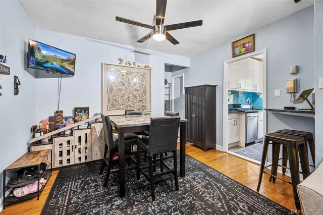 a dining room with furniture and window