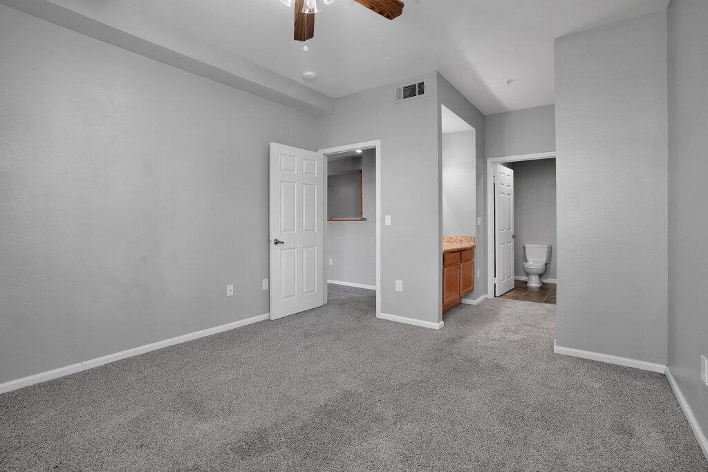 375 Central Avenue, Unit 10 Riverside, CA 92507 - Photo 14 of 33 an empty room with closet and windows