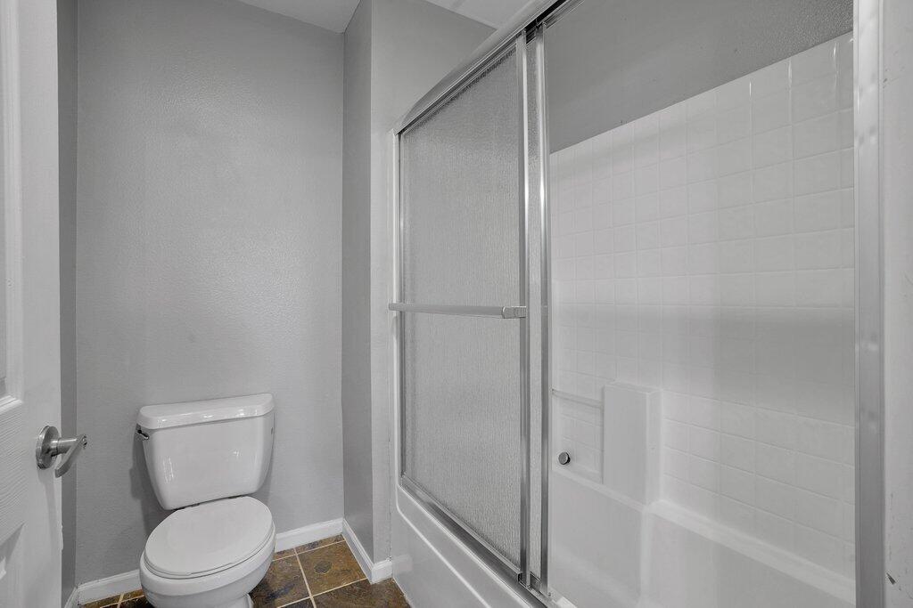 375 Central Avenue, Unit 10 Riverside, CA 92507 - Photo 17 of 33 a white toilet sitting next to a bathtub