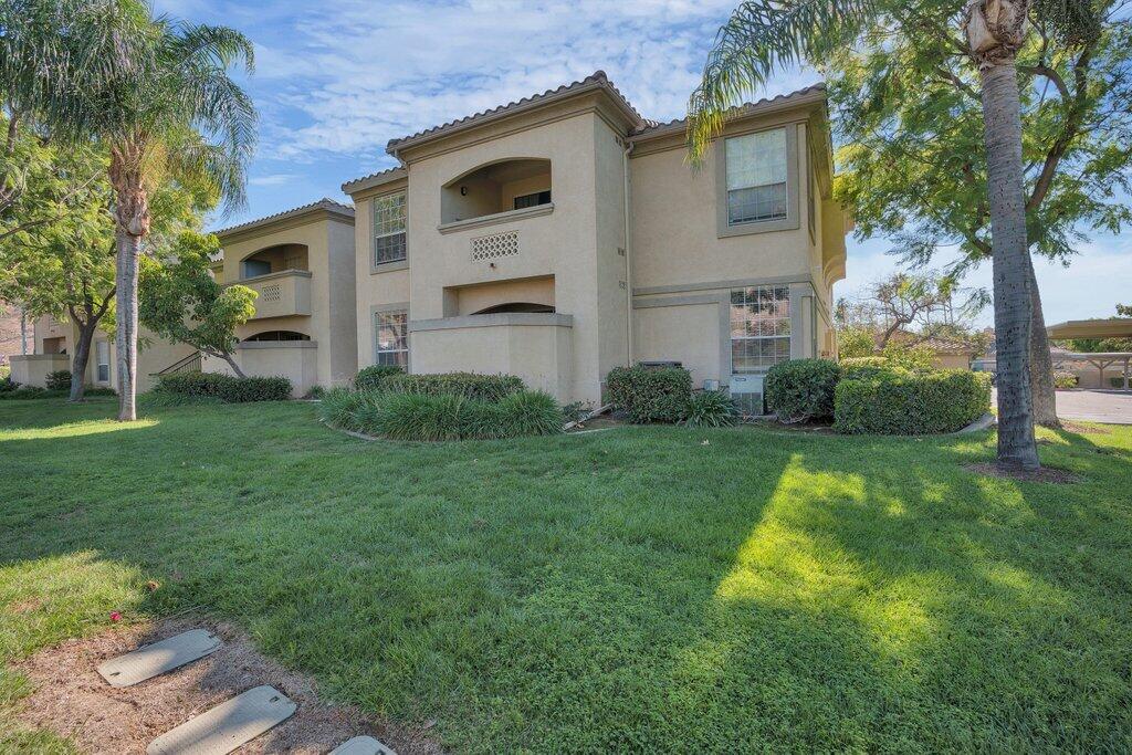 375 Central Avenue, Unit 10 Riverside, CA 92507 - Photo 29 of 33 a backyard of a house with plants and large tree