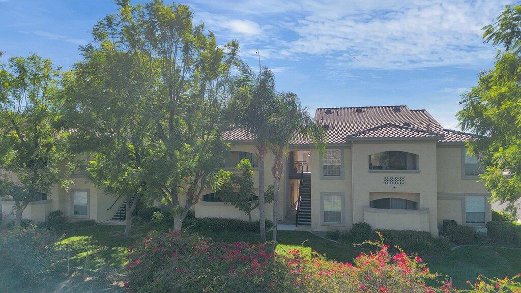 375 Central Avenue, Unit 10 Riverside, CA 92507 - Photo 32 of 33 a front view of a house with a yard