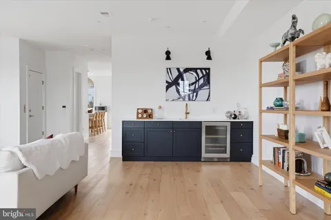 a view of a bedroom with furniture and window