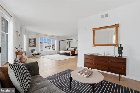 a living room with furniture and a table