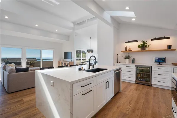 a kitchen with stainless steel appliances a white stove top oven and a refrigerator