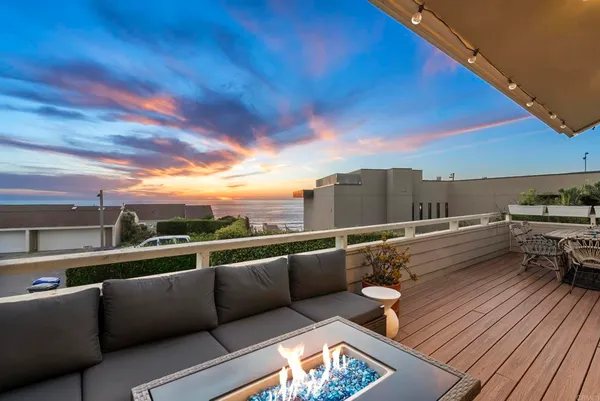 a view of roof deck with furniture