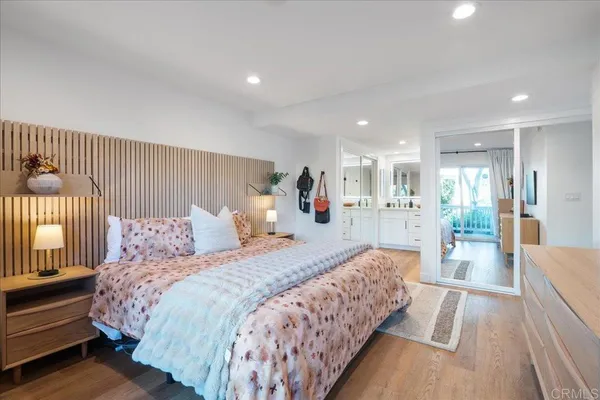 a spacious bathroom with a granite countertop sink mirror and
