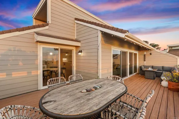 a view of a terrace with furniture and garden