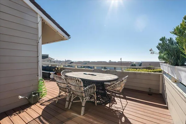 a view of a patio with a table and chairs