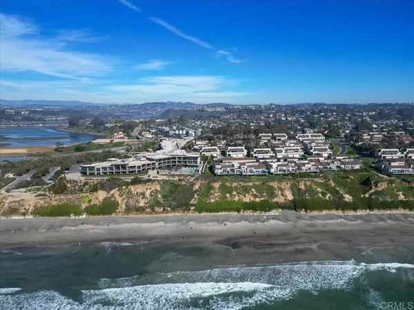 an aerial view of a house with a swimming pool
