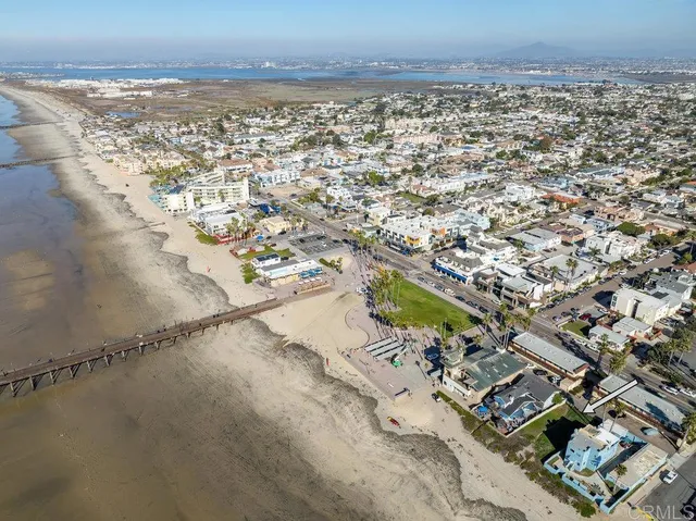 an aerial view of residential building and ocean