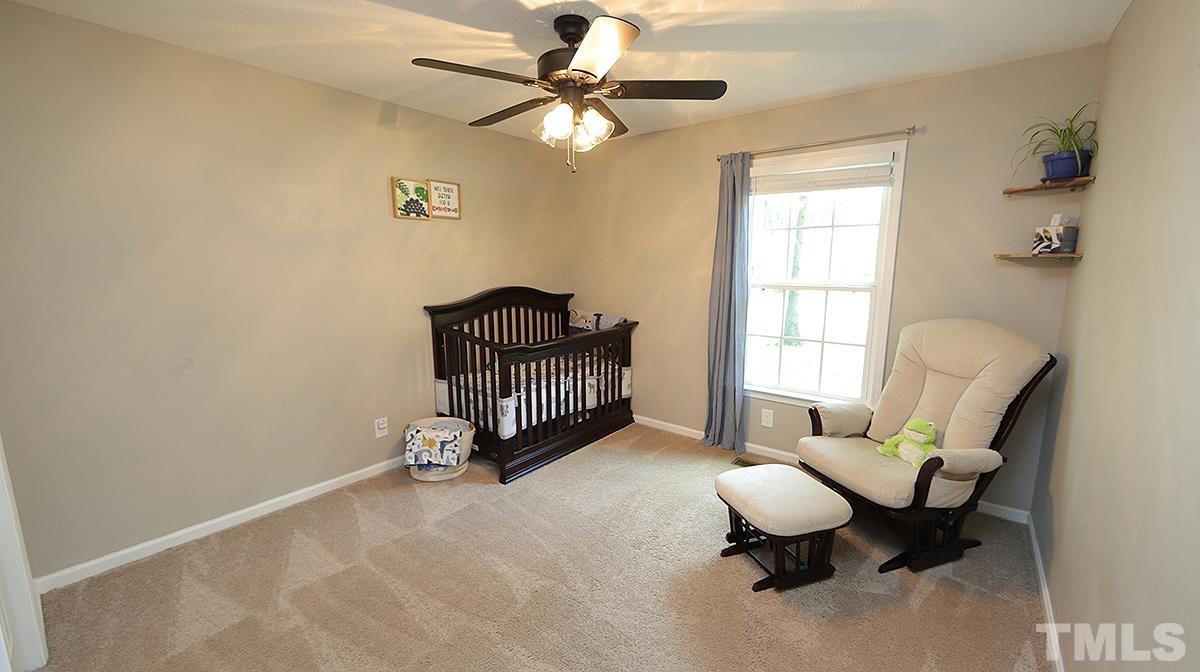 1706 Cranston Road Garner, NC 27529 - Photo 9 of 13 a living room with furniture and a window