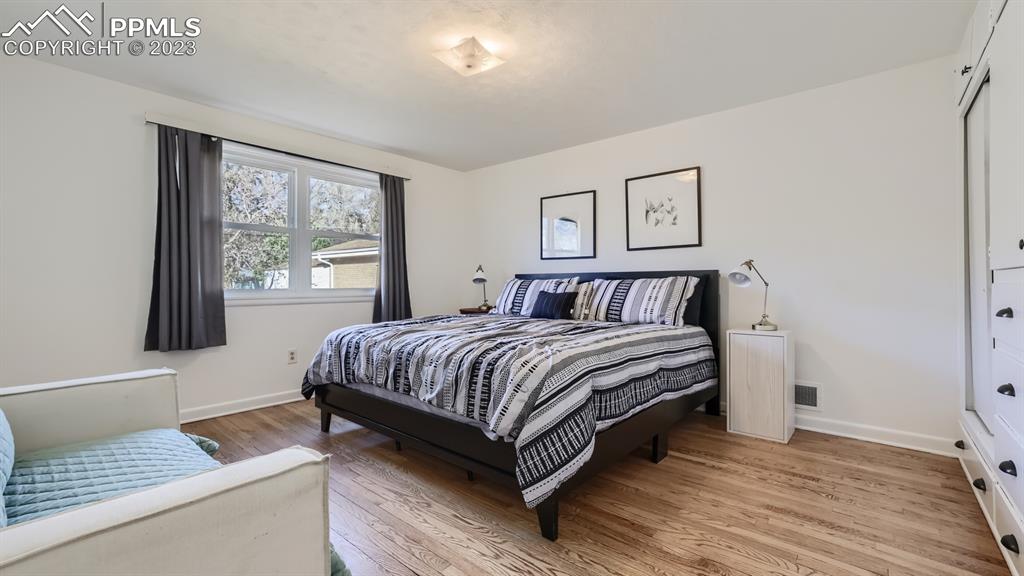 530 Valley Road Colorado Springs, CO 80904 - Photo 15 of 50 a bedroom with a bed and window