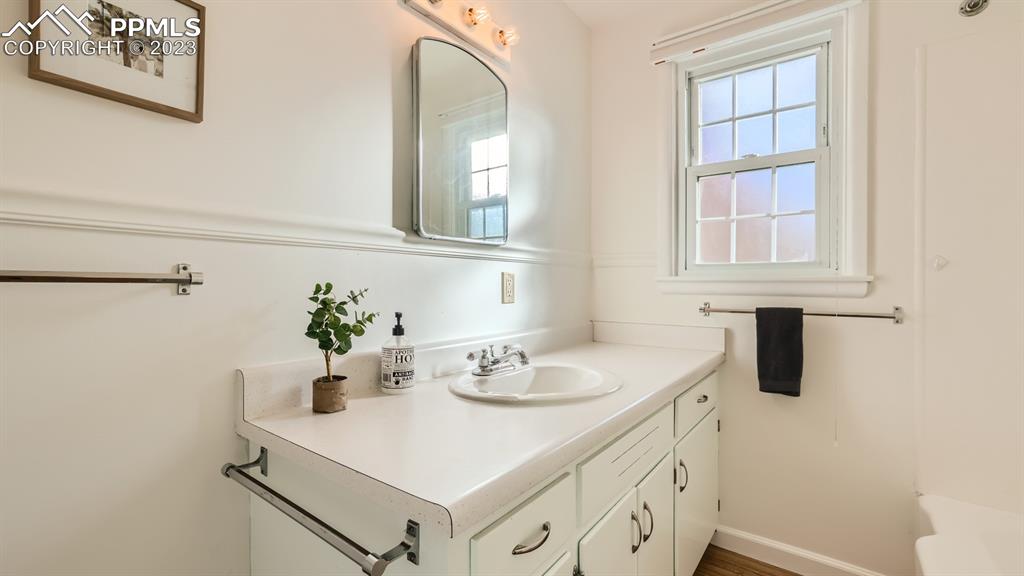 530 Valley Road Colorado Springs, CO 80904 - Photo 20 of 50 a bathroom with a sink and a mirror