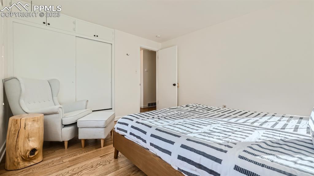 530 Valley Road Colorado Springs, CO 80904 - Photo 24 of 50 a bedroom with a bed and a chair