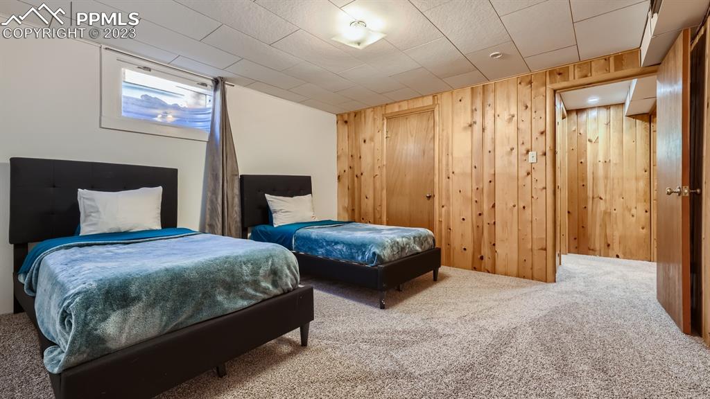 530 Valley Road Colorado Springs, CO 80904 - Photo 33 of 50 a bedroom with a bed and a mirror