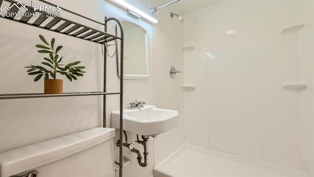 530 Valley Road Colorado Springs, CO 80904 - Photo 38 of 50 a bathroom with a sink toilet and shower