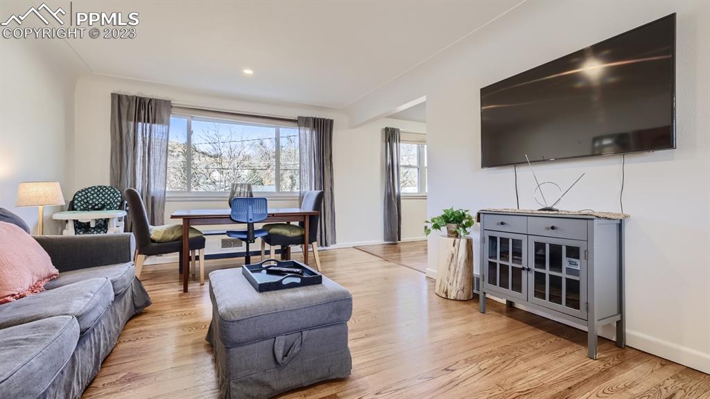 530 Valley Road Colorado Springs, CO 80904 - Photo 6 of 50 a living room with furniture and a flat screen tv