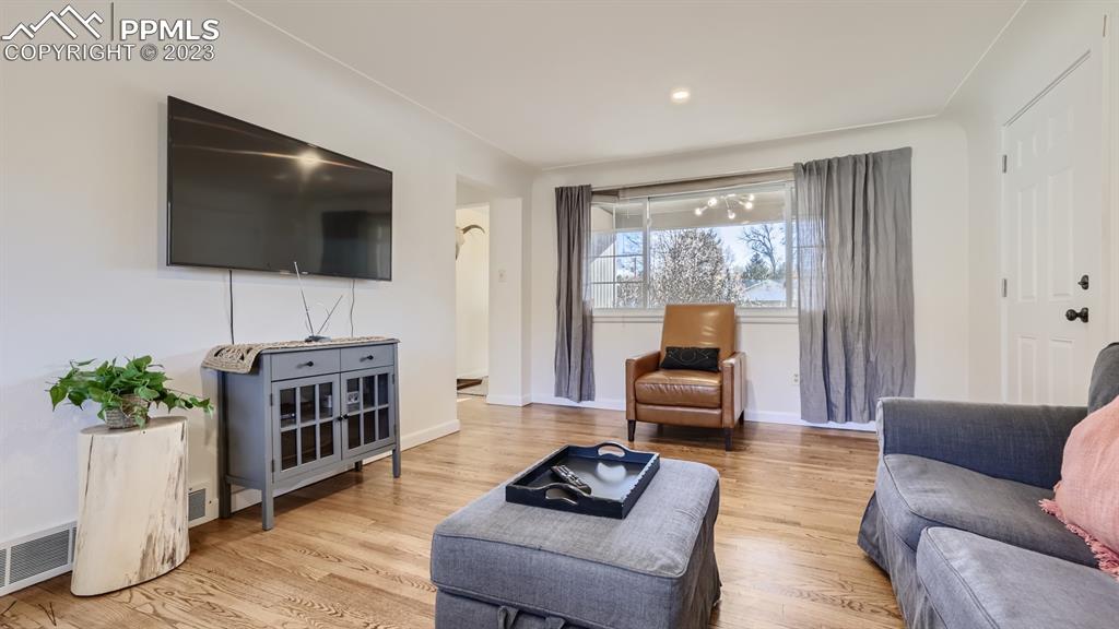 530 Valley Road Colorado Springs, CO 80904 - Photo 8 of 50 a living room with furniture and a flat screen tv