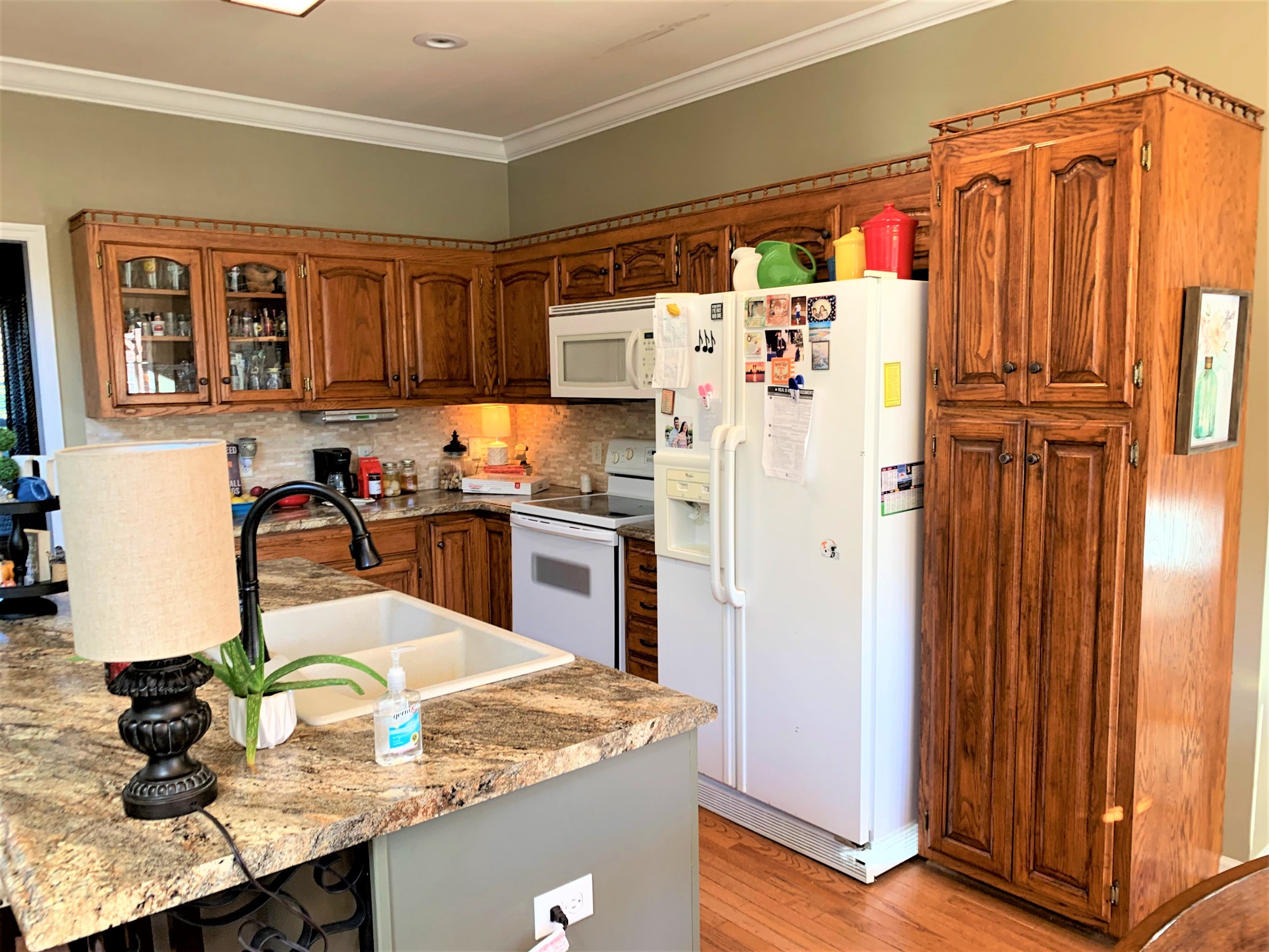 83 Old Quick Road Fayetteville, TN 37334 - Photo 14 of 41 a kitchen with stainless steel appliances granite countertop a refrigerator a sink and white cabinets