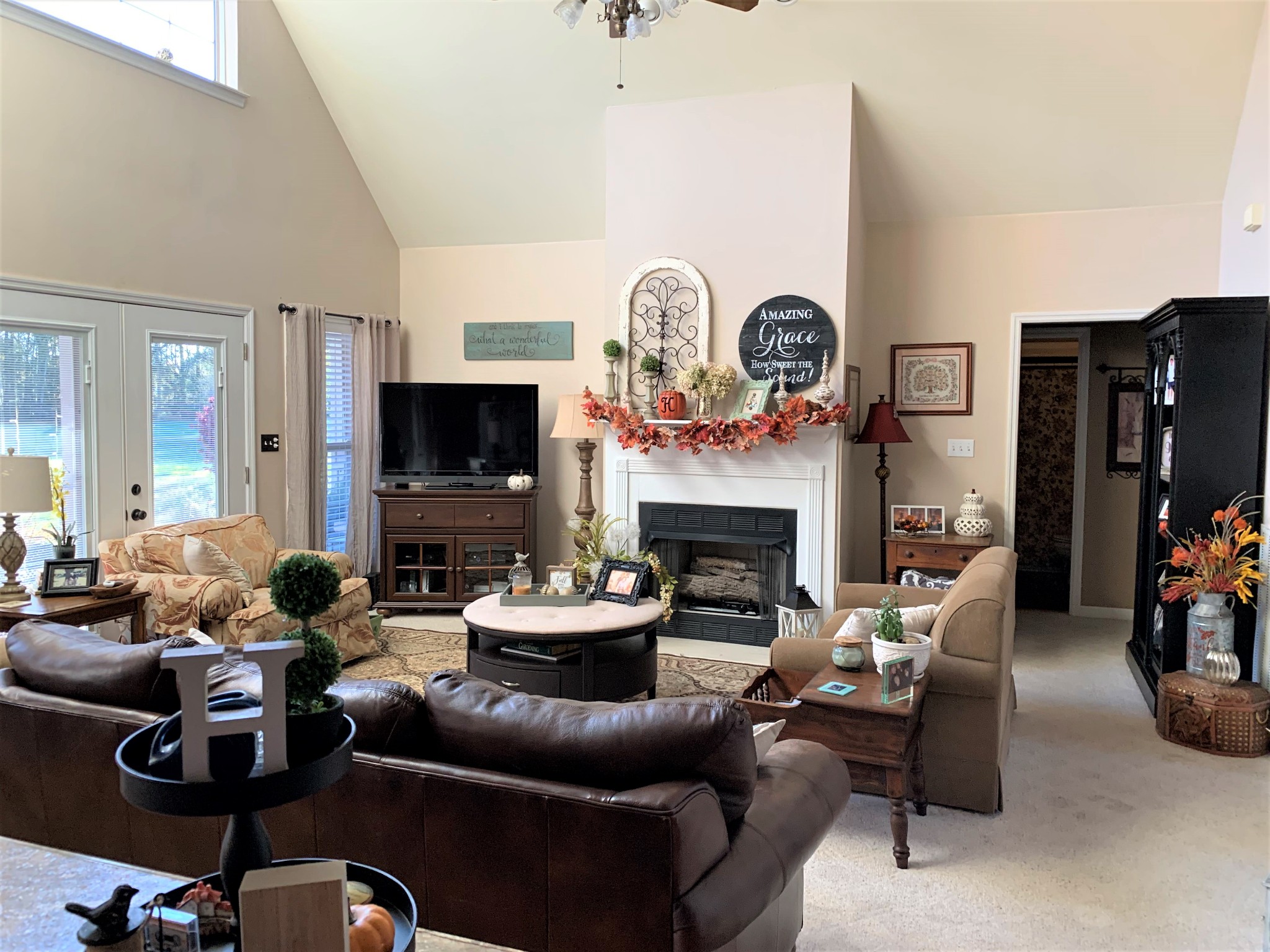 83 Old Quick Road Fayetteville, TN 37334 - Photo 22 of 41 a living room with furniture a flat screen tv and a fireplace