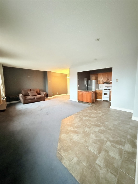 140 Chestnut Street, Unit 604 Springfield, MA 01103 - Photo 6 of 21 a view of a livingroom with a flat screen tv