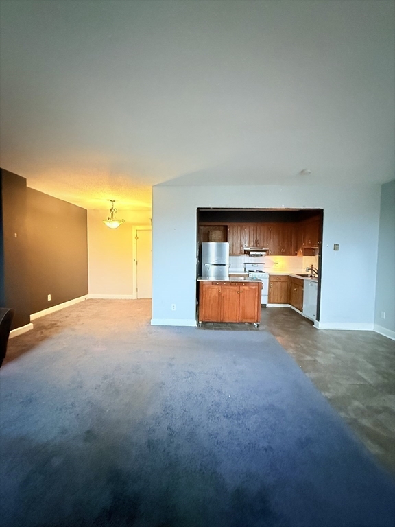 140 Chestnut Street, Unit 604 Springfield, MA 01103 - Photo 7 of 21 a view of empty room with a fireplace
