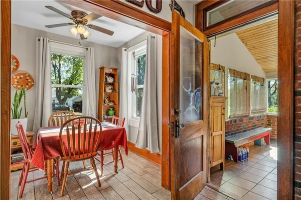 a balcony with a table and chairs