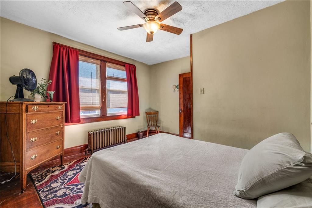 3475 Darlington Road Darlington, PA 16115 - Photo 8 of 17 a bedroom with a bed and a dresser next to a window