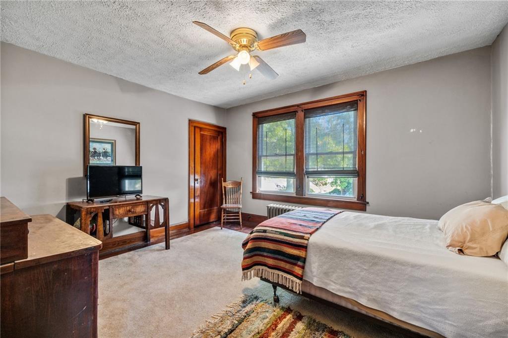 3475 Darlington Road Darlington, PA 16115 - Photo 9 of 17 a bedroom with a bed and a table in it