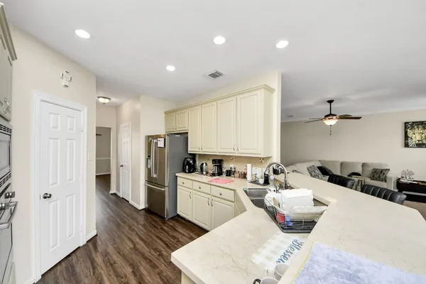a kitchen with a sink and refrigerator