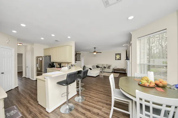 a view of a dining room with furniture
