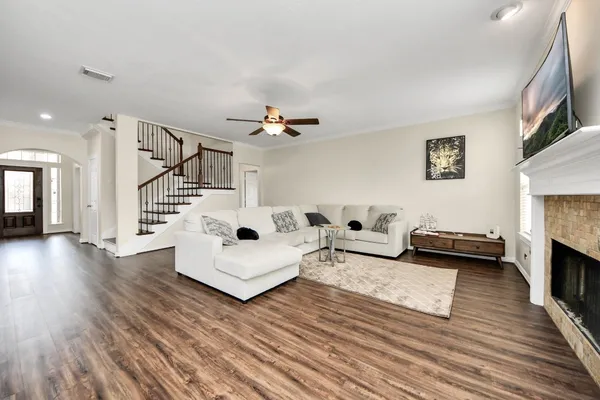 a living room with furniture and a fireplace