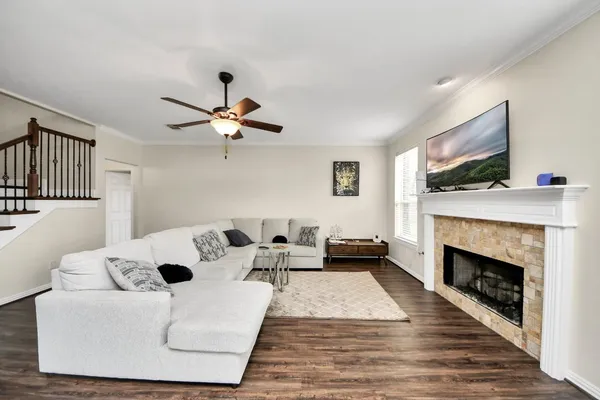 a living room with furniture and a fireplace