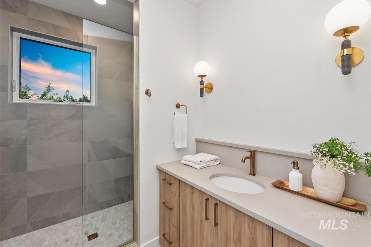 3219 West Moore Street Boise, ID 83702 - Photo 29 of 36 Shower with large format gray tile walls and white hexagonal tile flooring