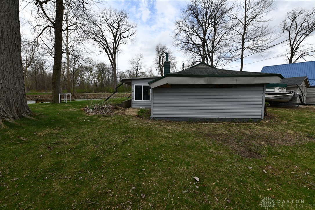 5445 Behm Road, Unit 15 Celina, OH 45822 - Photo 43 of 49 This property features a charming exterior with ample green space and nearby water access.