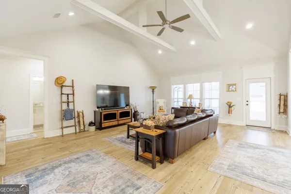 a large kitchen with lots of counter space and stainless steel appliances