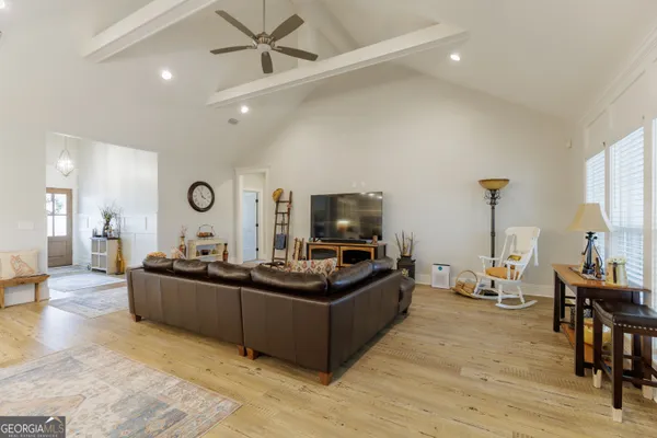 a kitchen with stainless steel appliances sink stove microwave and cabinets