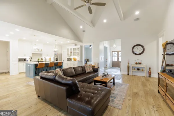 a kitchen with stainless steel appliances white cabinets and stove