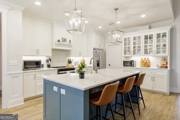 a kitchen with stainless steel appliances granite countertop lots of counter top space