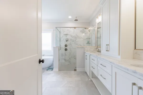 a white bath tub sitting next to a window