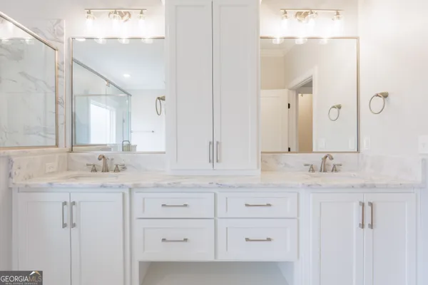 a view of a workspace with furniture and windows