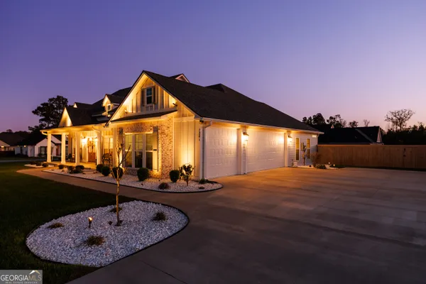 front view of a house with a yard