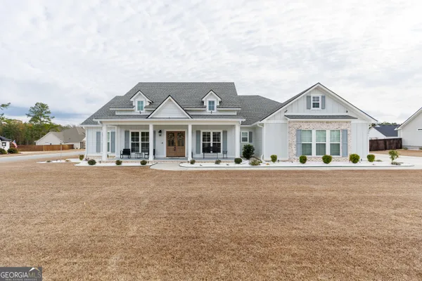 front view of a house with a yard