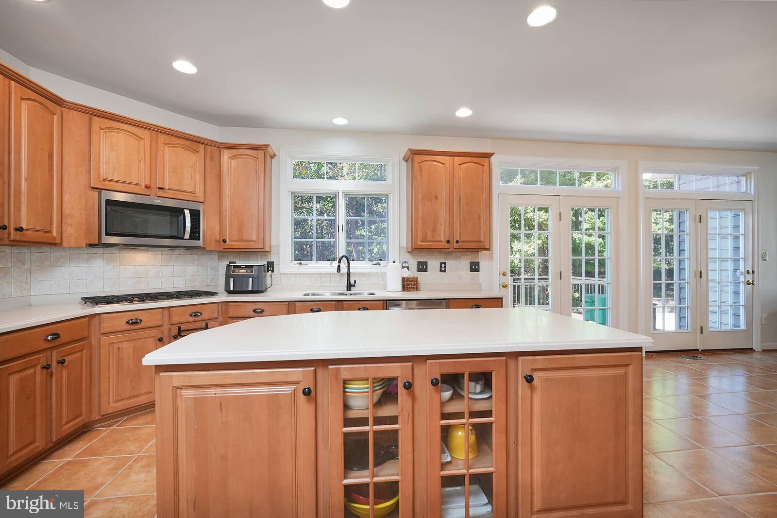 13014 English Turn Drive Silver Spring, MD 20904 - Photo 4 of 10 a kitchen with stainless steel appliances granite countertop a stove a sink and a microwave