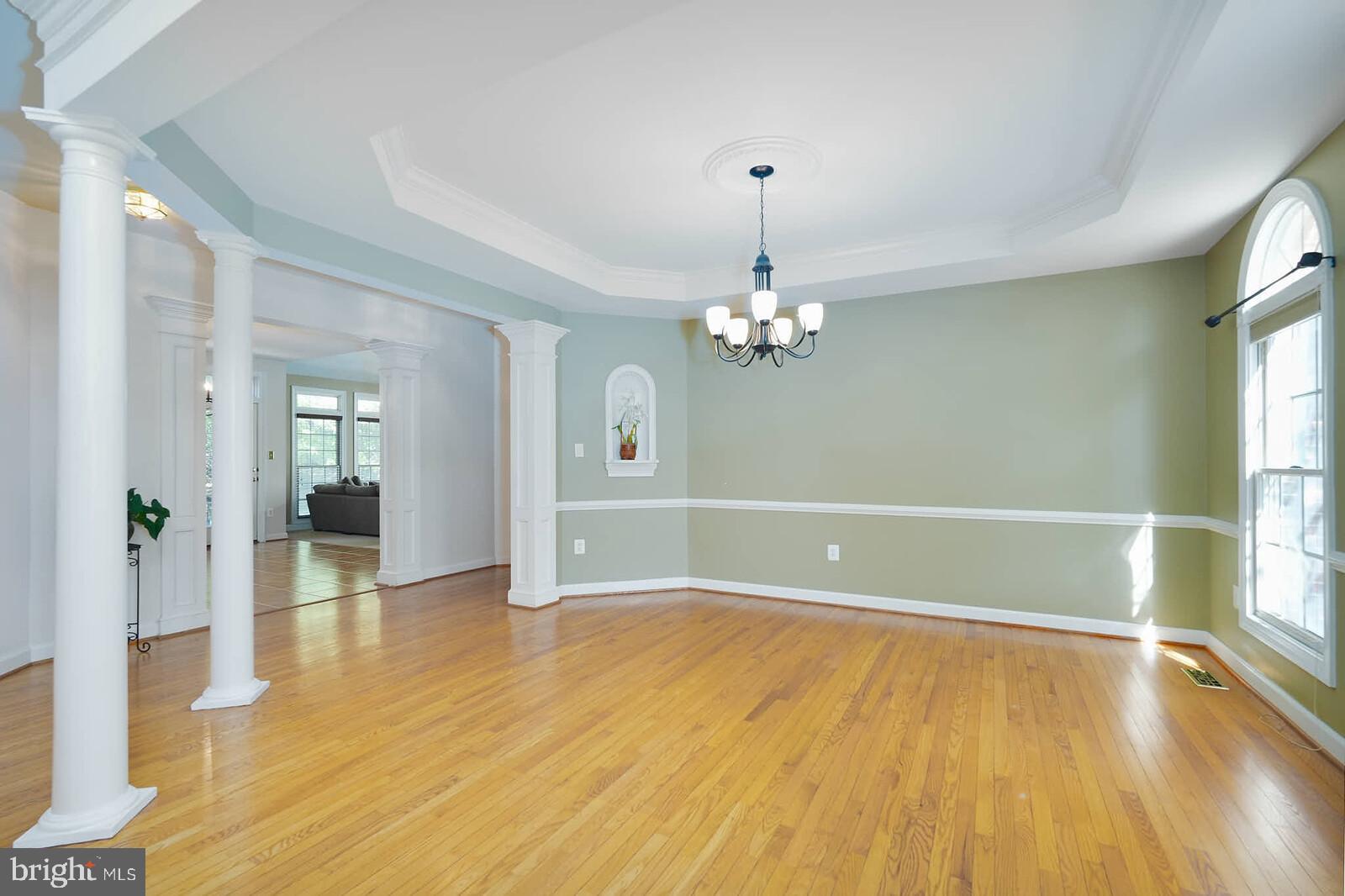 13014 English Turn Drive Silver Spring, MD 20904 - Photo 4 of 10 a view of empty room with wooden floor and fan