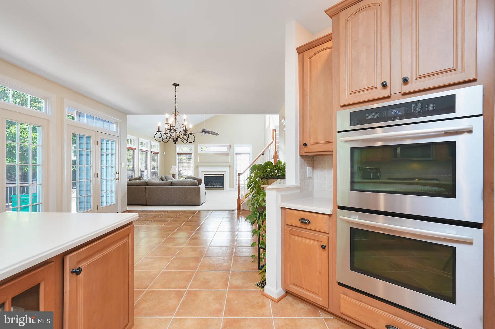 13014 English Turn Drive Silver Spring, MD 20904 - Photo 5 of 10 a kitchen with stainless steel appliances a stove top oven and cabinets