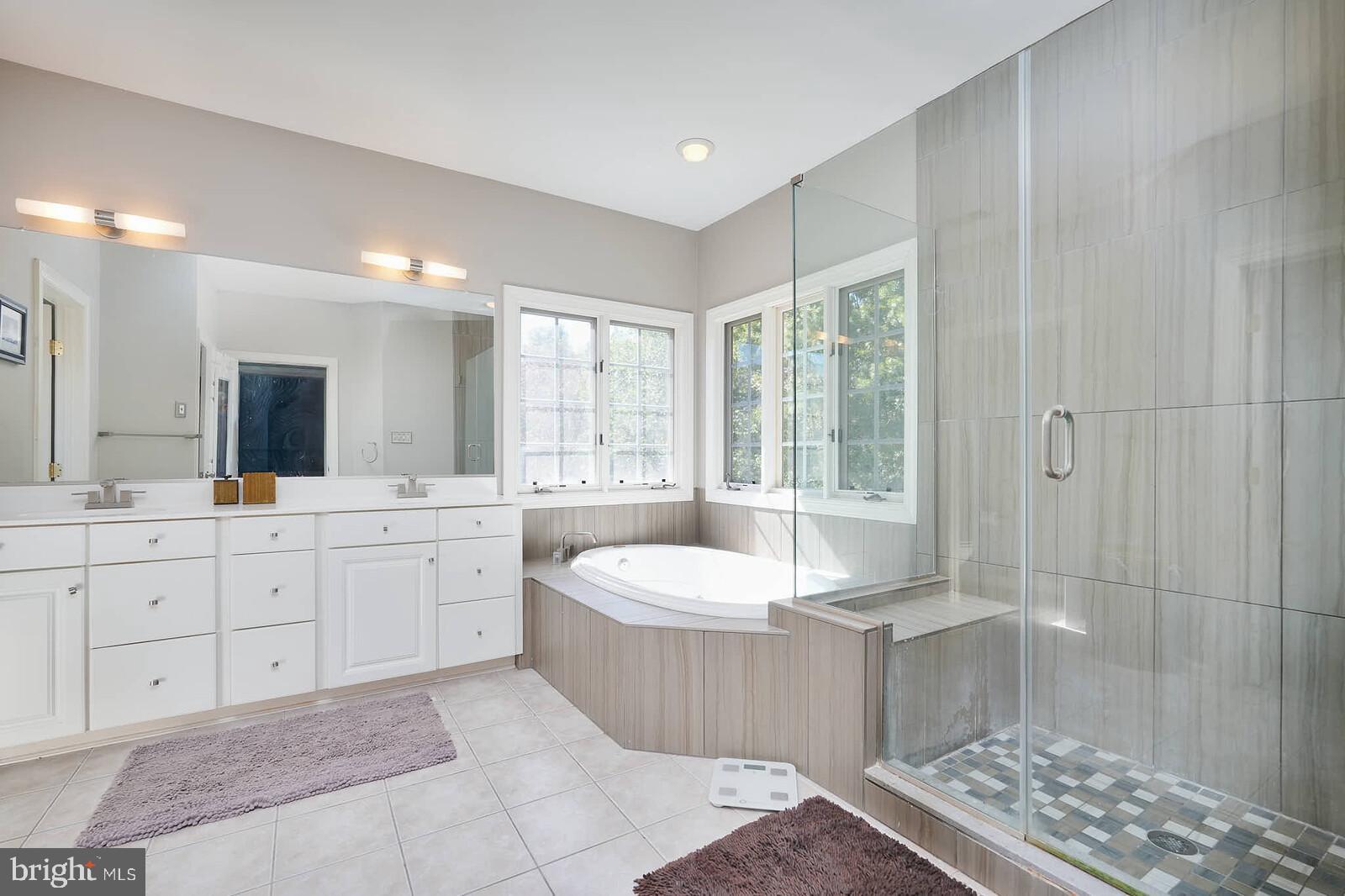 13014 English Turn Drive Silver Spring, MD 20904 - Photo 9 of 10 a large bathroom with a tub sink and mirror