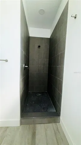 a view of a room with wooden floor