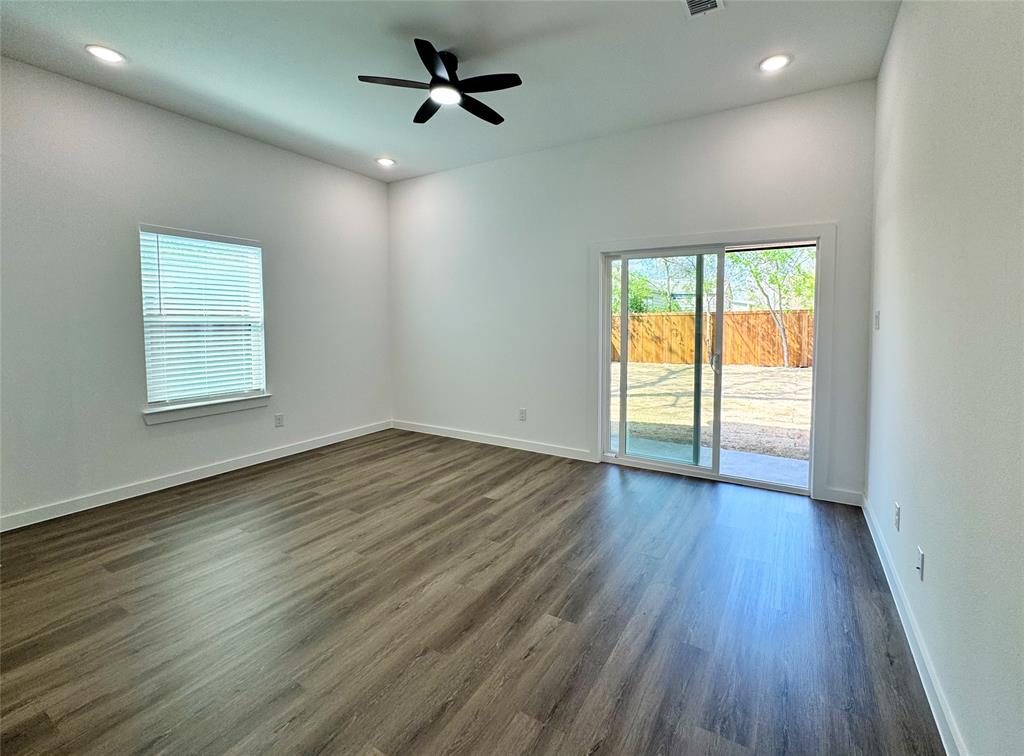 1811 Washington Street Commerce, TX 75428 - Photo 20 of 36 wooden floor in an empty room with a window